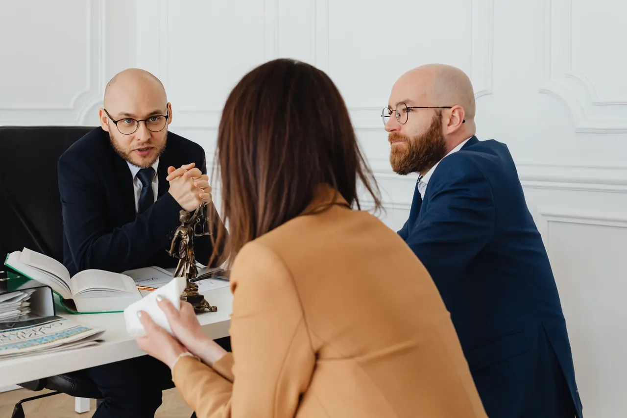 A solicitor meeting clients in a bright London office